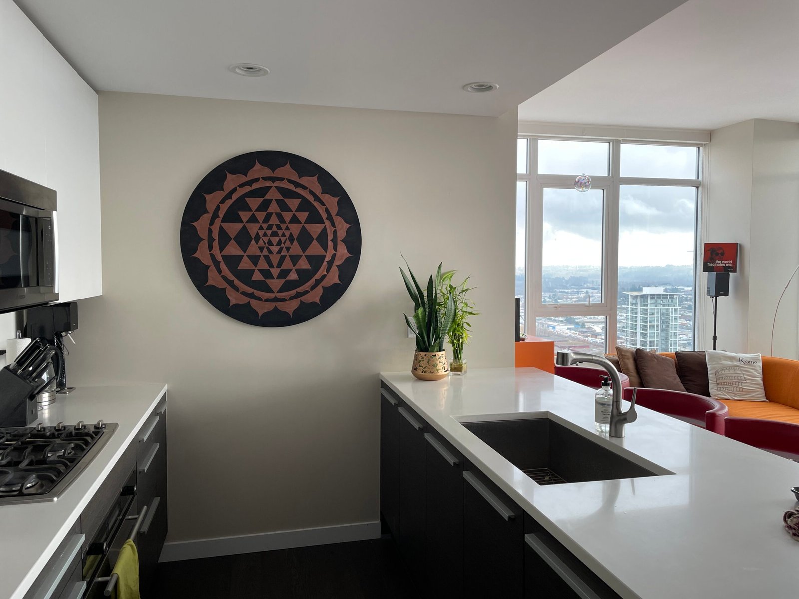 Sri Yantra - Radiant Heart of Consciousness wall mounted round mandala in a modern condo